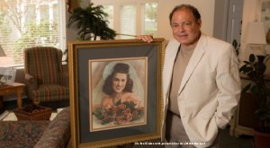 With portrait of his mother, Millie Michaels